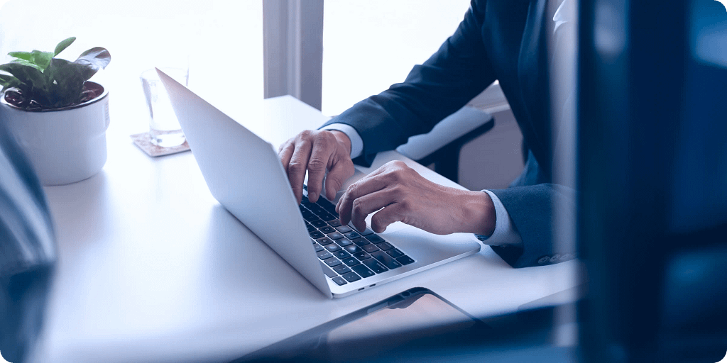 Cover image for article on launching a digital gift card business in 2026 Professional person working on laptop representing digital gift card business 2026 growth and fintech innovation.