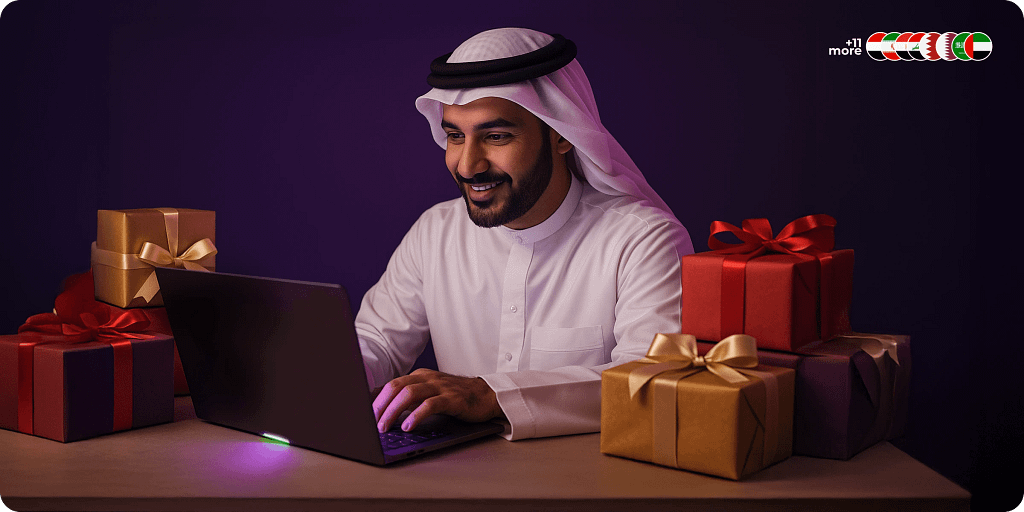 Popular gift cards across the MENA region showing the rise of digital gifting culture through online platforms Arab man smiling while shopping online with colorful gift boxes representing popular gift cards in the MENA region